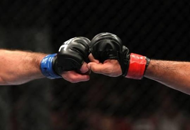 two gloved fists clashing